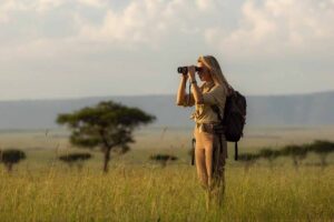 Solo safari in Africa with a traveller watching elephants in Tanzania and Kenya: With Grand World Tours