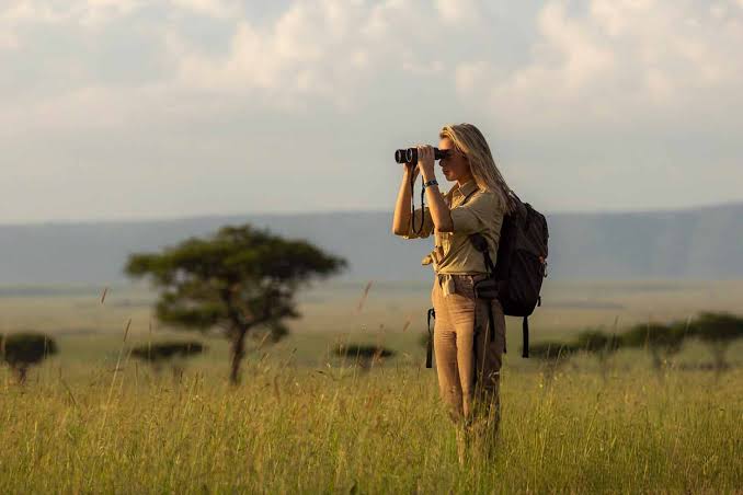 Solo safari in Africa with a traveller watching elephants in Tanzania and Kenya: With Grand World Tours